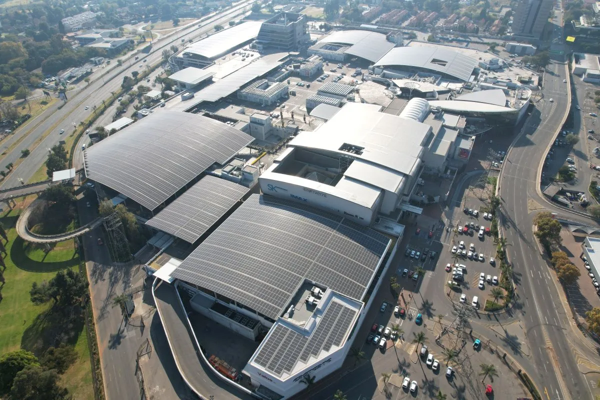 Solar panels on the curved roof sections of a large shopping mall