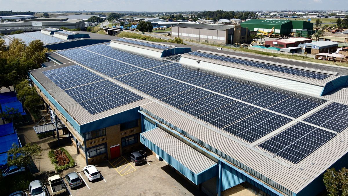 Solar panels across the roof of a refrigerated industrial warehouse serving cold storage operations